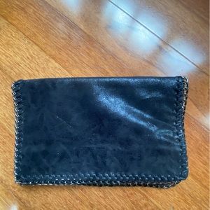 Black clutch with whipstitch chain looks just like the stella McCartney